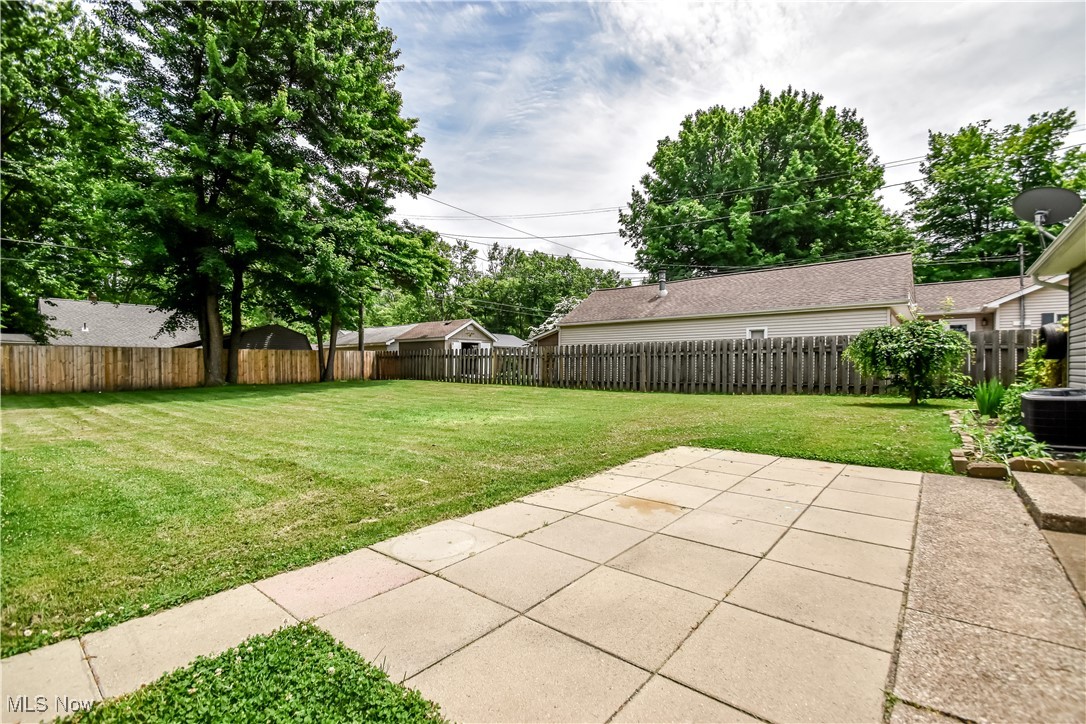 1919 Sandgate Road Madison, OH 44057 - Photo 22 of 28 Fenced backyard with a patio