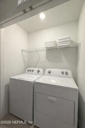 a utility room with dryer and washer