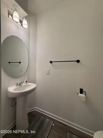 a bathroom with a sink toilet and vanity
