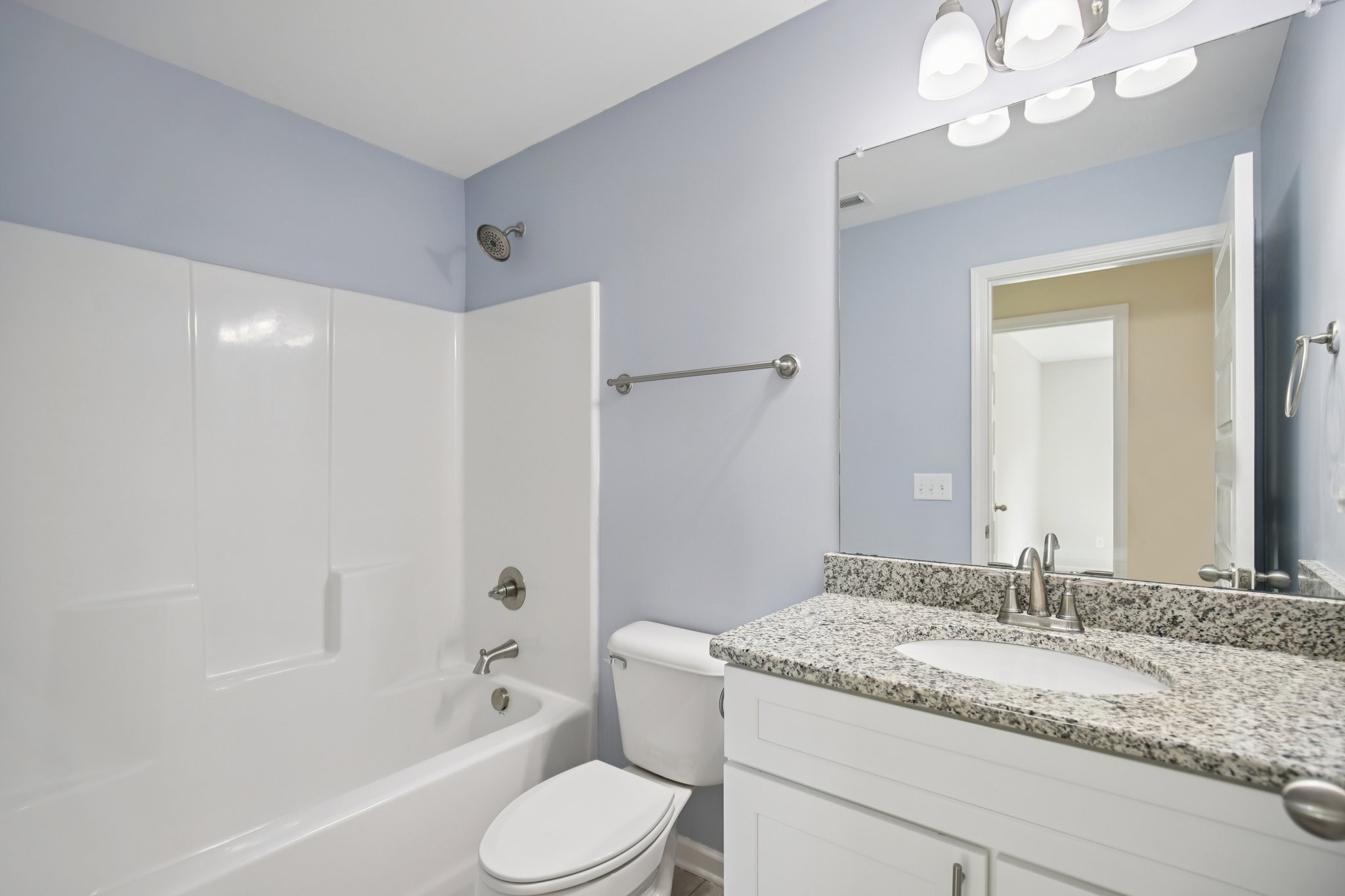 135 Ray Jent Road Bethpage, TN 37022 - Photo 11 of 17 a bathroom with a granite countertop sink a toilet and bathtub