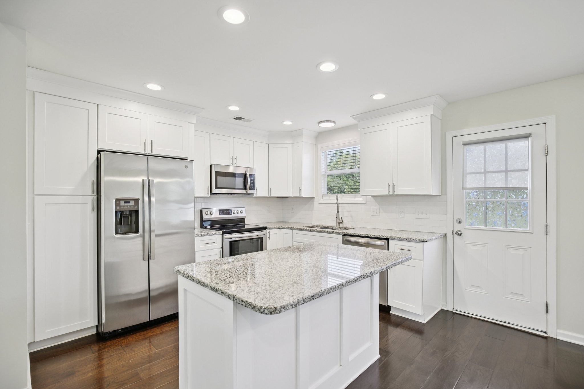 135 Ray Jent Road Bethpage, TN 37022 - Photo 4 of 17 a kitchen with stainless steel appliances granite countertop a sink stove and refrigerator
