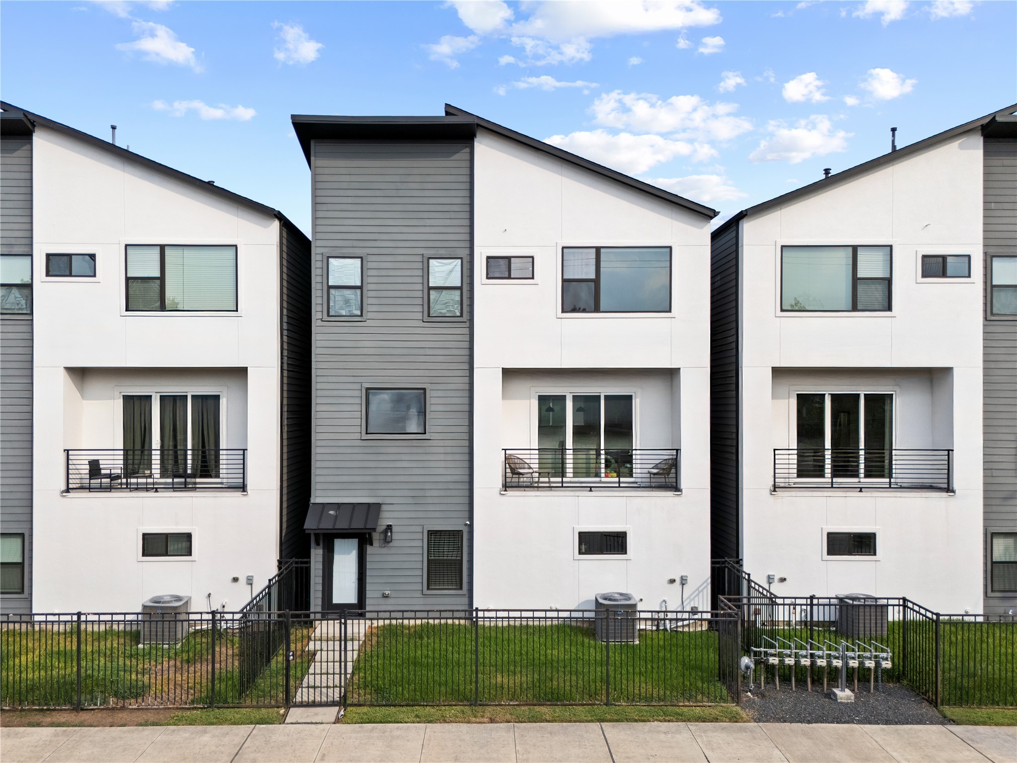 2404 Hadley Street, Unit C Houston, TX 77004 - Photo 1 of 16 a front view of a house with a yard