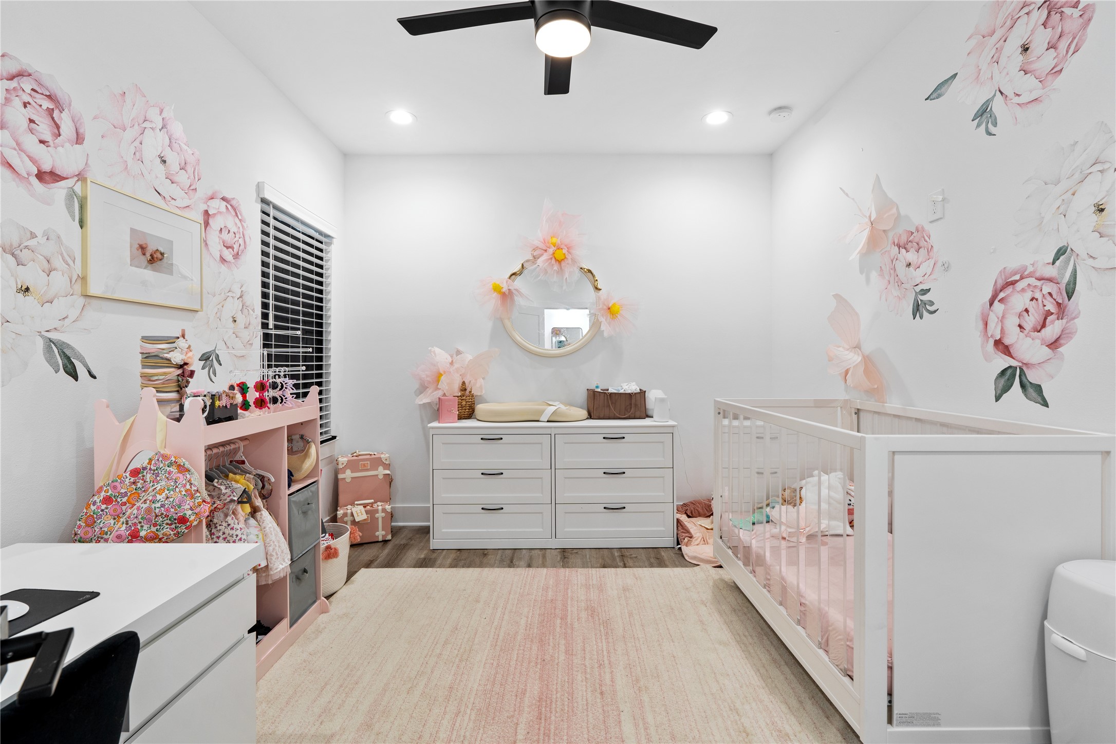 2404 Hadley Street, Unit C Houston, TX 77004 - Photo 12 of 16 a bedroom with a bed and wooden floor