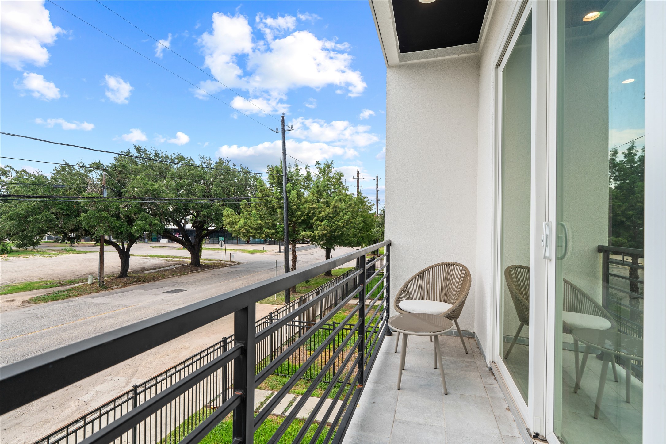 2404 Hadley Street, Unit C Houston, TX 77004 - Photo 6 of 16 a view of a balcony with chairs