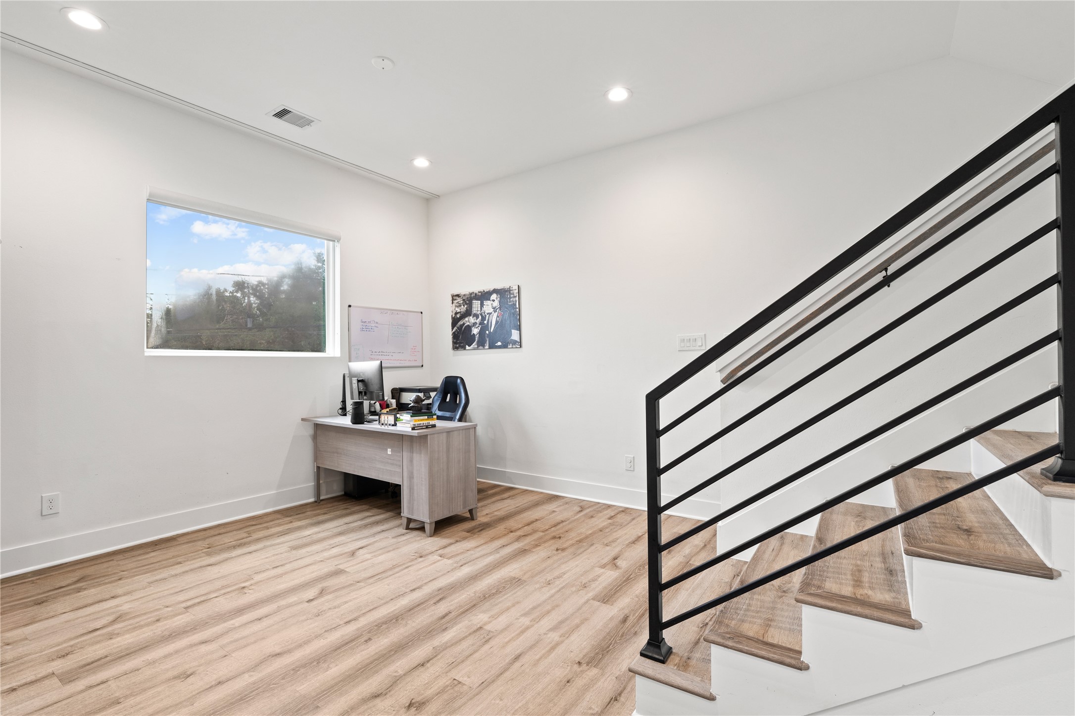 2404 Hadley Street, Unit C Houston, TX 77004 - Photo 8 of 16 a view of entryway with wooden floor