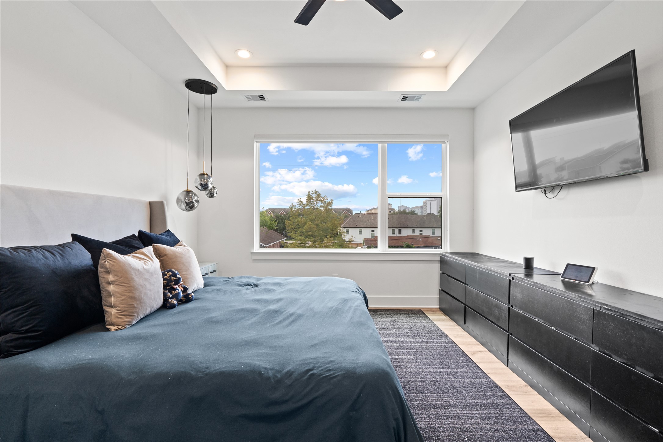 2404 Hadley Street, Unit C Houston, TX 77004 - Photo 9 of 16 a bed room with a bed and a television