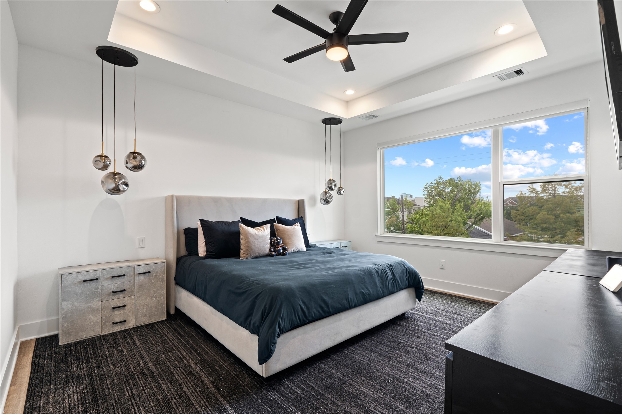 2404 Hadley Street, Unit C Houston, TX 77004 - Photo 10 of 16 a bedroom with a bed and a large window