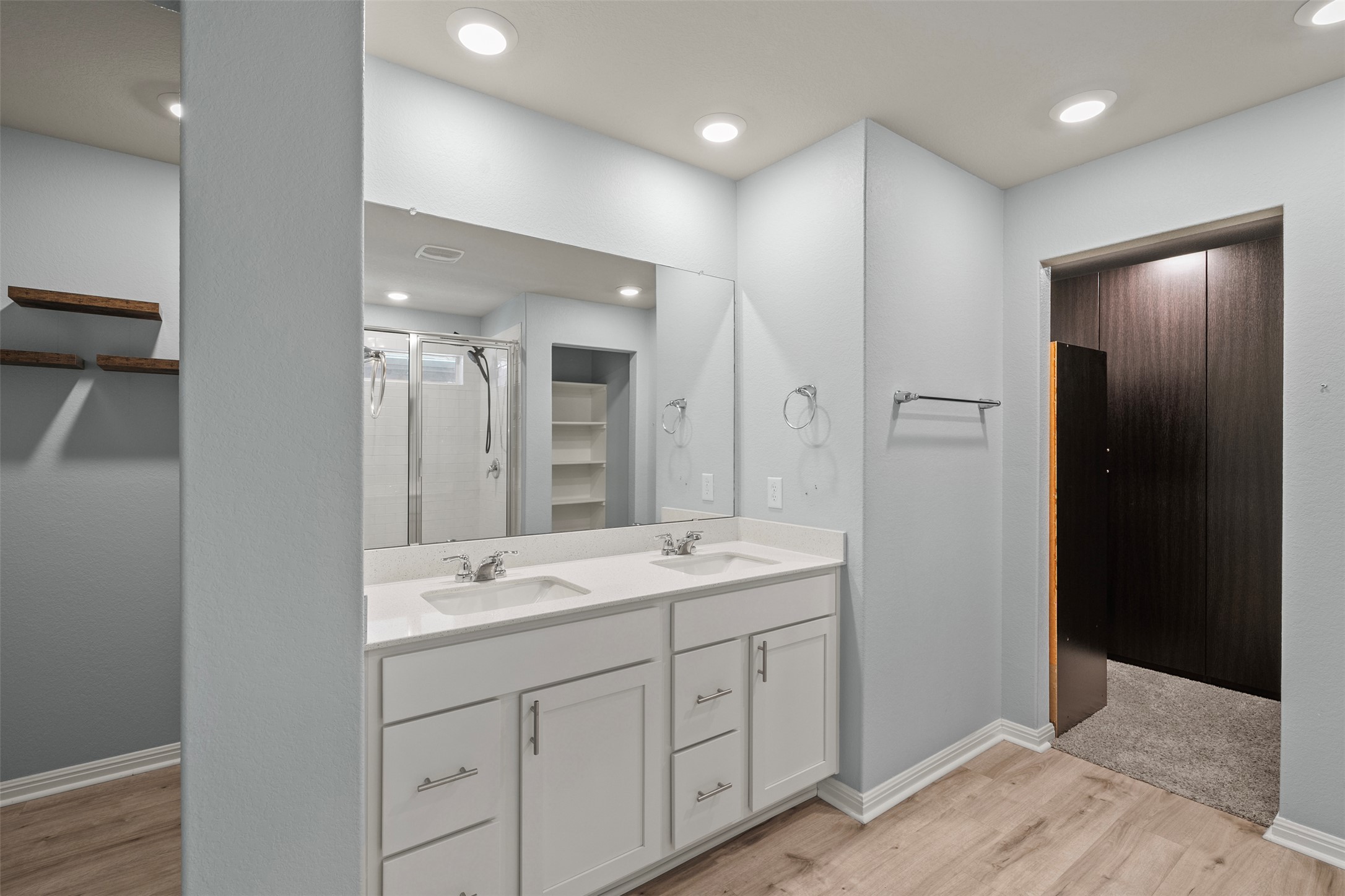 120 Ellinger Road Georgetown, TX 78626 - Photo 8 of 28 Dual vanity with white cabinetry, integrated sinks, and a large wall-mounted mirror