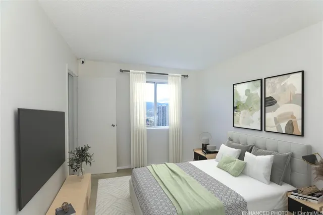 a bedroom with a bed and a painting on the wall