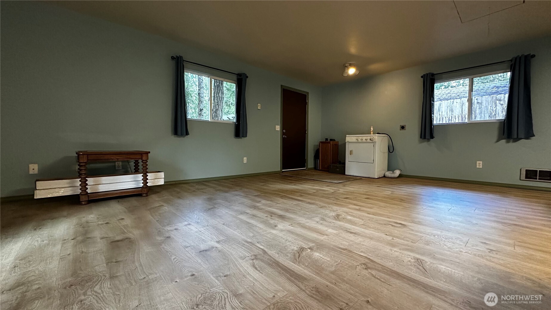 271 Salmon Street Brinnon, WA 98320 - Photo 15 of 17 a view of a room with wooden floor and window