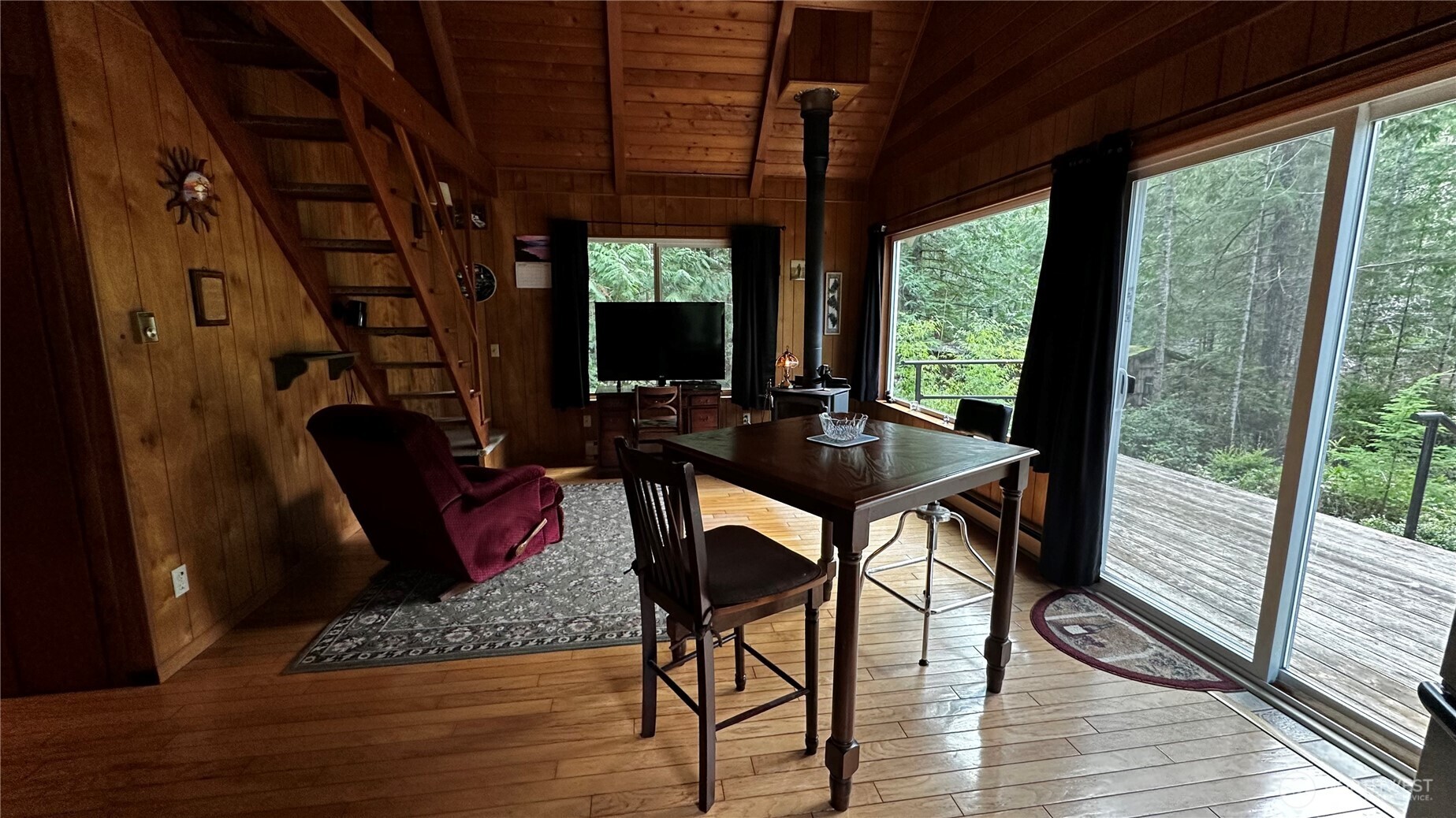 271 Salmon Street Brinnon, WA 98320 - Photo 4 of 17 a view of a livingroom with furniture window and wooden floor