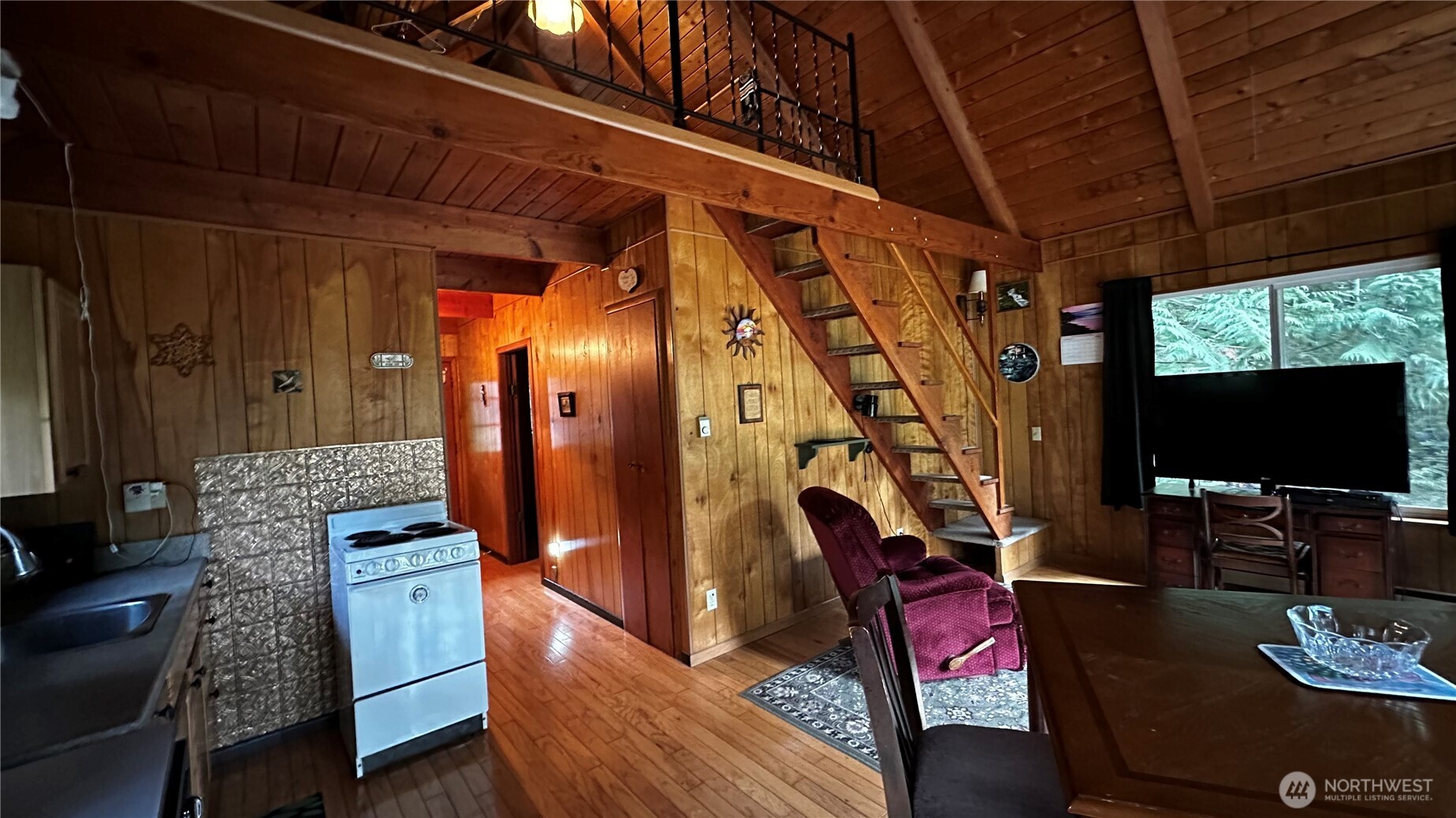 271 Salmon Street Brinnon, WA 98320 - Photo 5 of 17 a living room with furniture and a flat screen tv