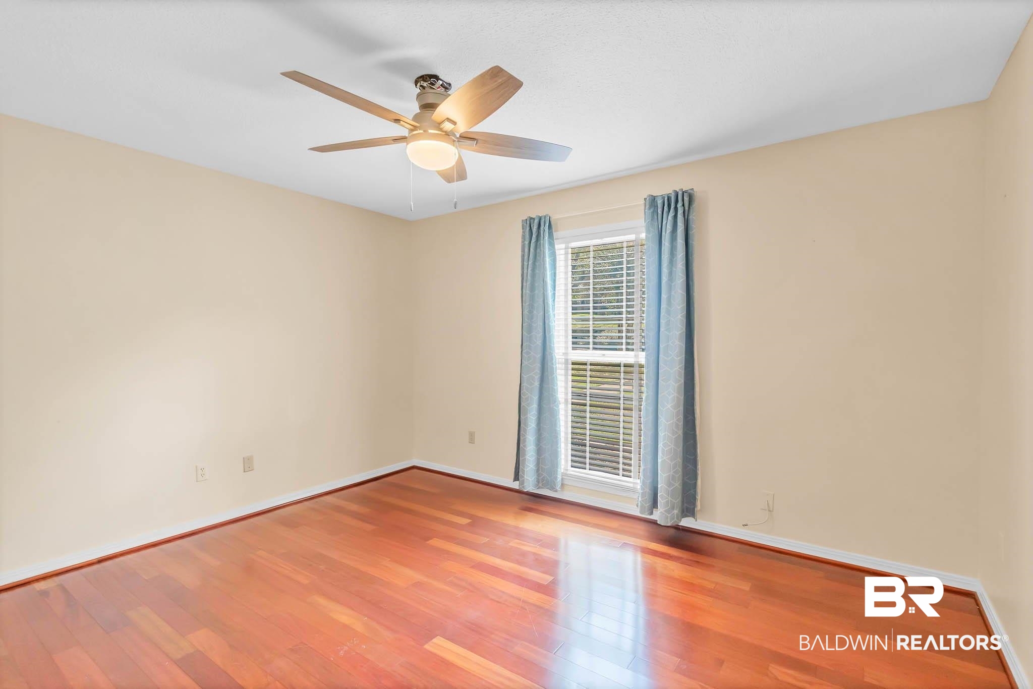 309 West Brandy Run Road Mobile, AL 36608 - Photo 53 of 100 Empty room with wood finished floors and ceiling fan