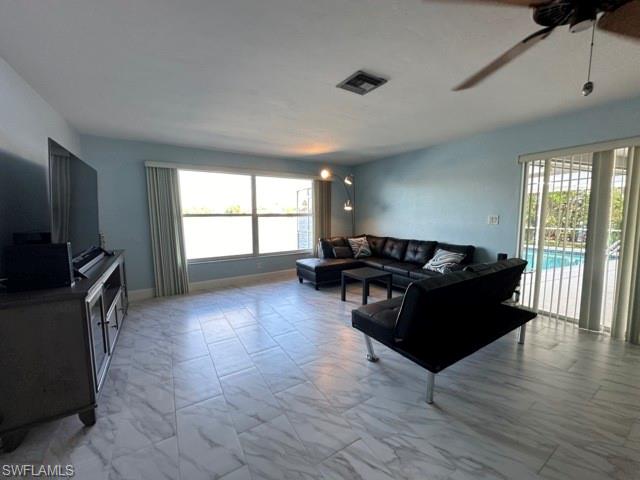 3065 50th Lane Southwest Naples, FL 34116 - Photo 12 of 21 a living room with furniture and a flat screen tv