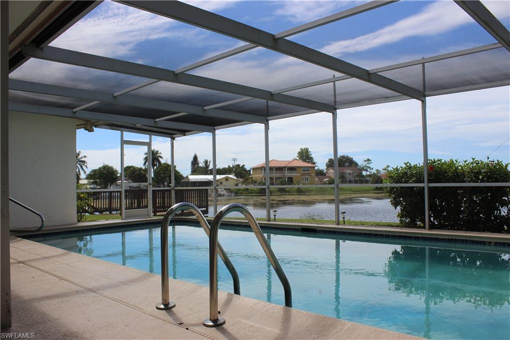 3065 50th Lane Southwest Naples, FL 34116 - Photo 4 of 21 a view of a lake from a roof deck