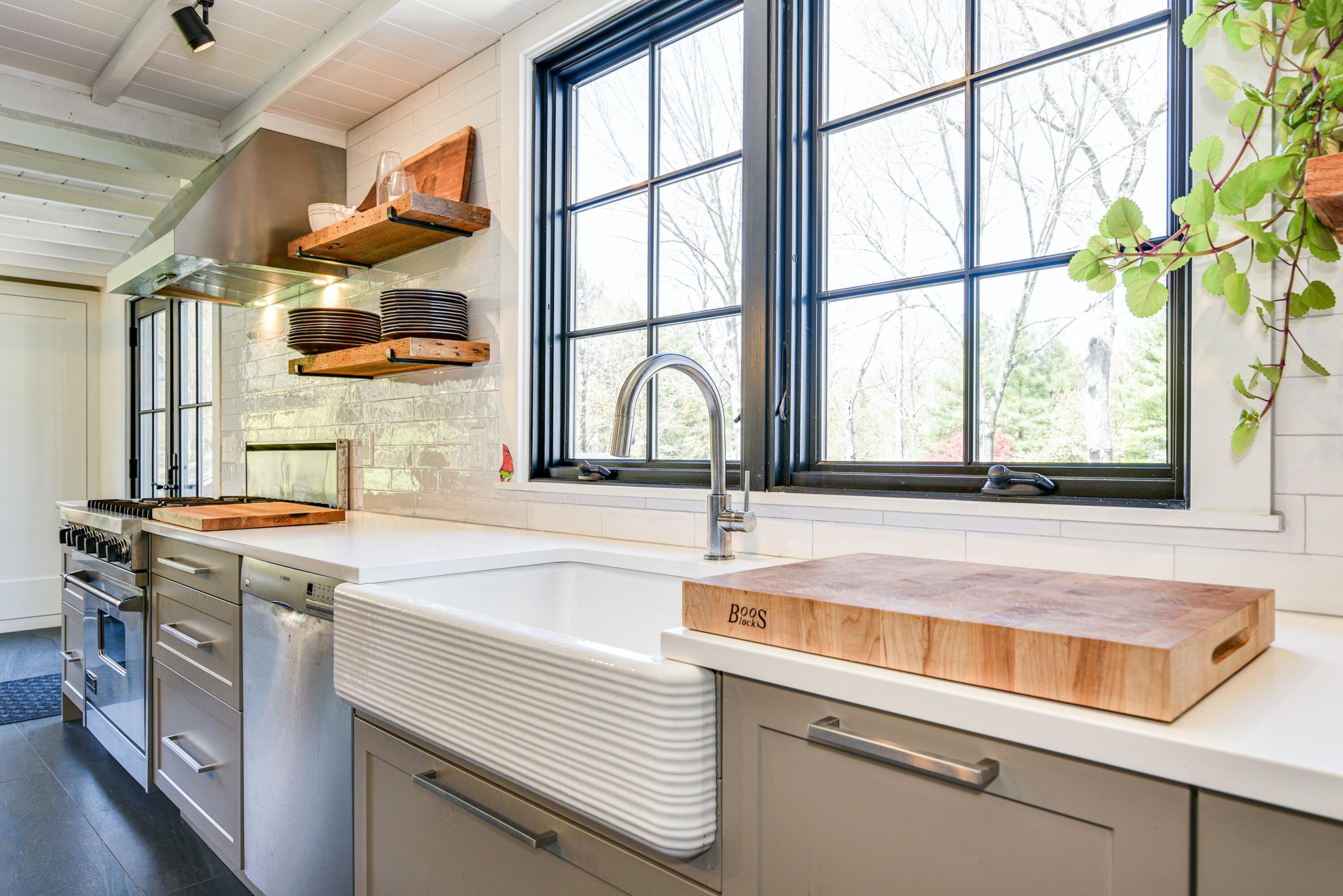 51 White Oak Shade Road New Canaan, CT 06840 - Photo 11 of 40 a kitchen with a sink and a window