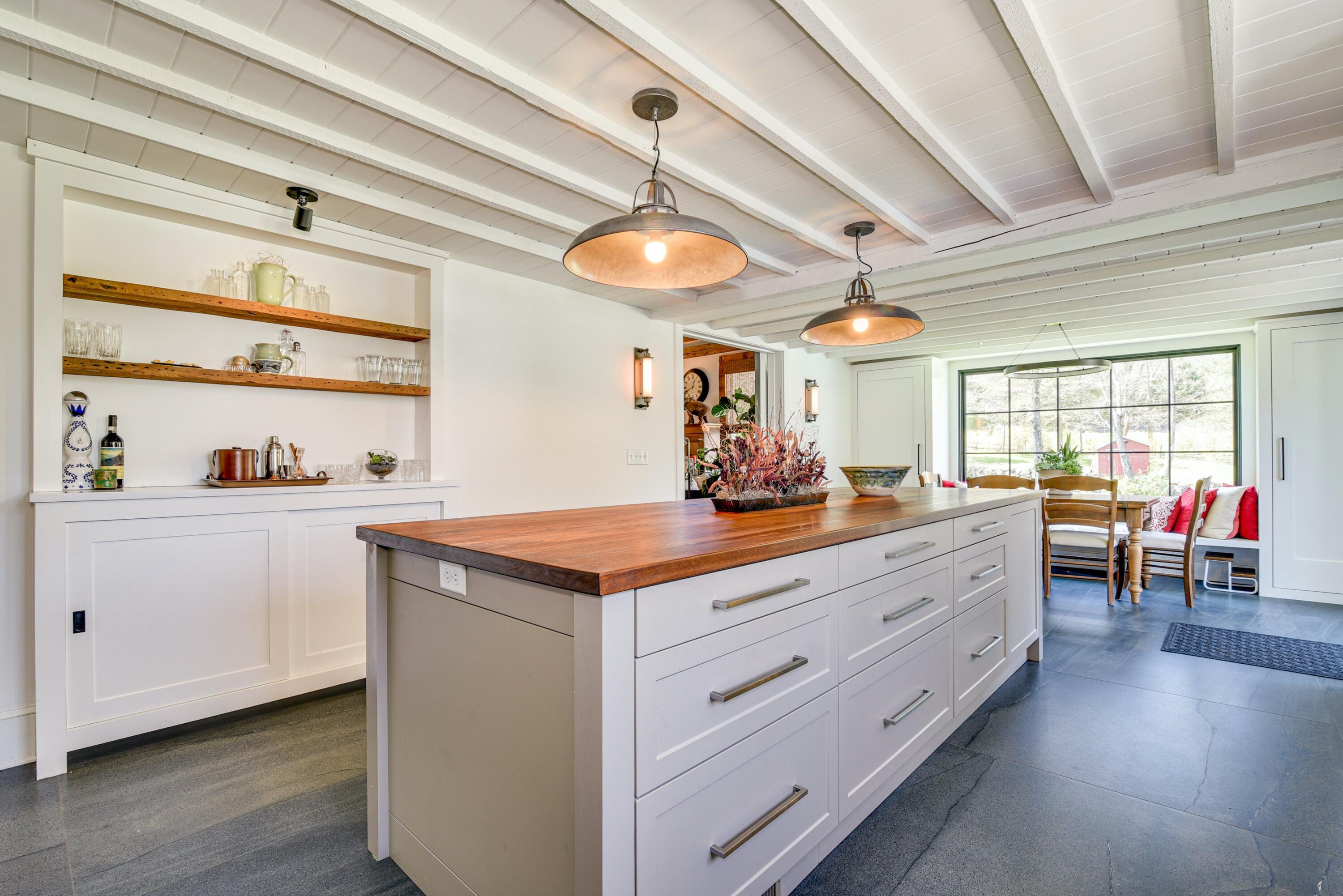 51 White Oak Shade Road New Canaan, CT 06840 - Photo 12 of 40 a view of a kitchen counter space a stove and wooden floor