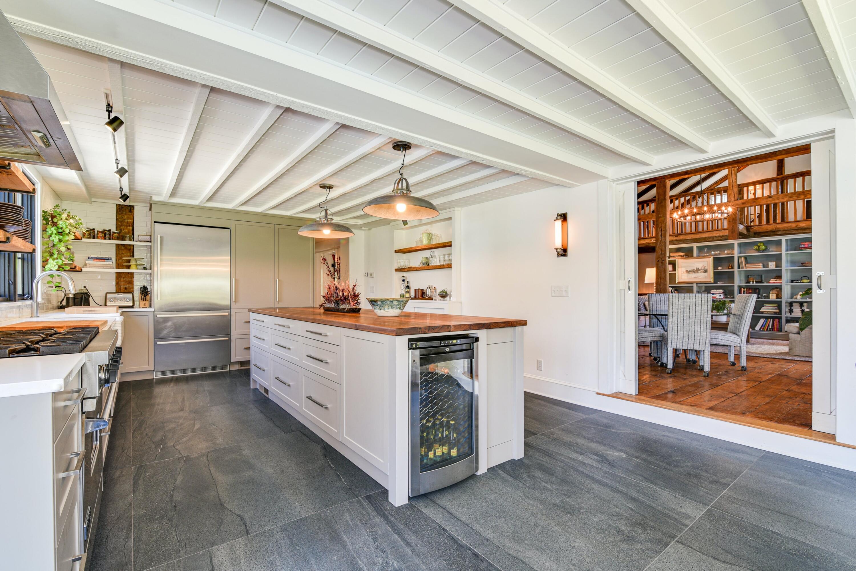 51 White Oak Shade Road New Canaan, CT 06840 - Photo 14 of 40 a utility room with cabinets dryer and washer