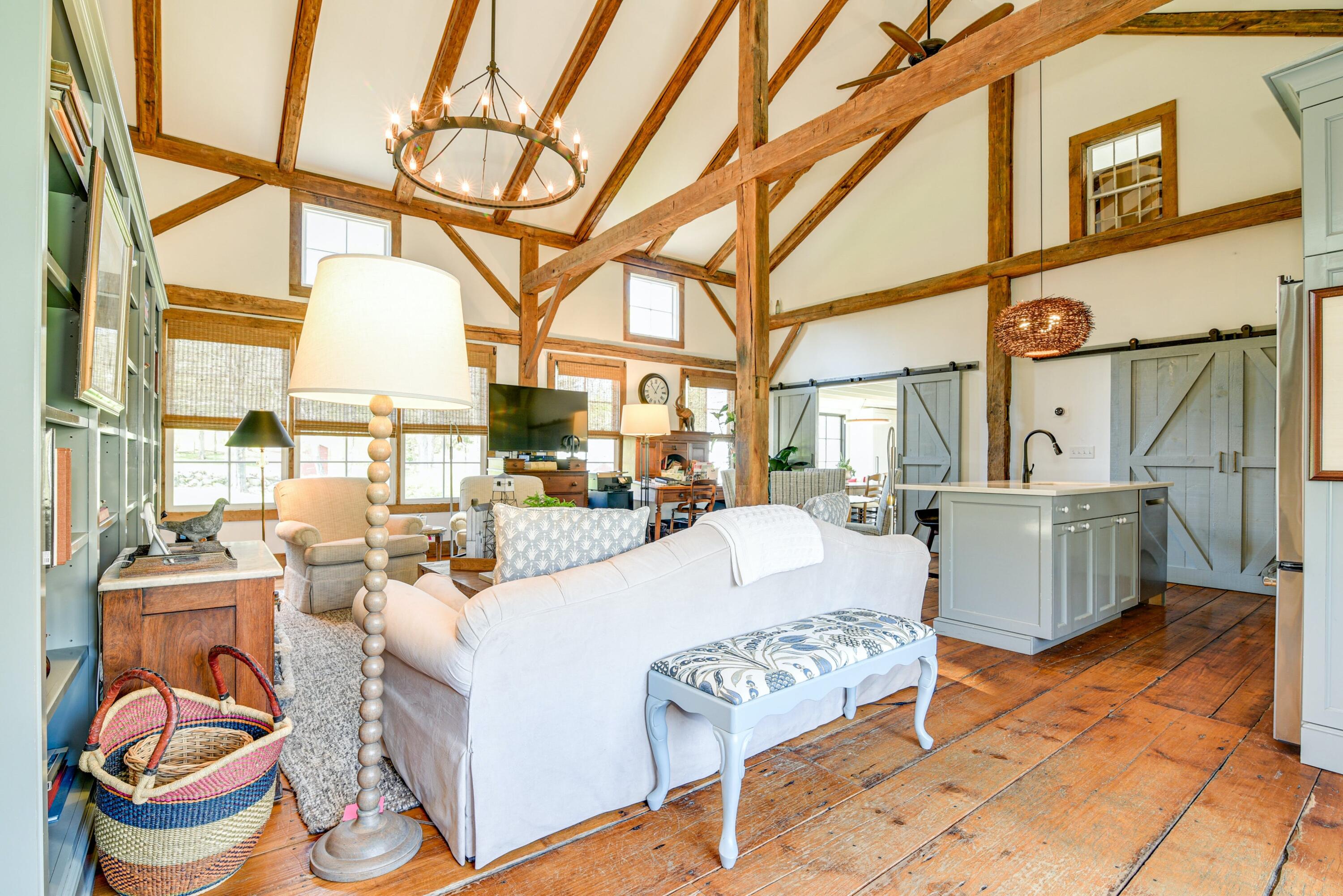 51 White Oak Shade Road New Canaan, CT 06840 - Photo 19 of 40 a living room with furniture and a floor to ceiling window