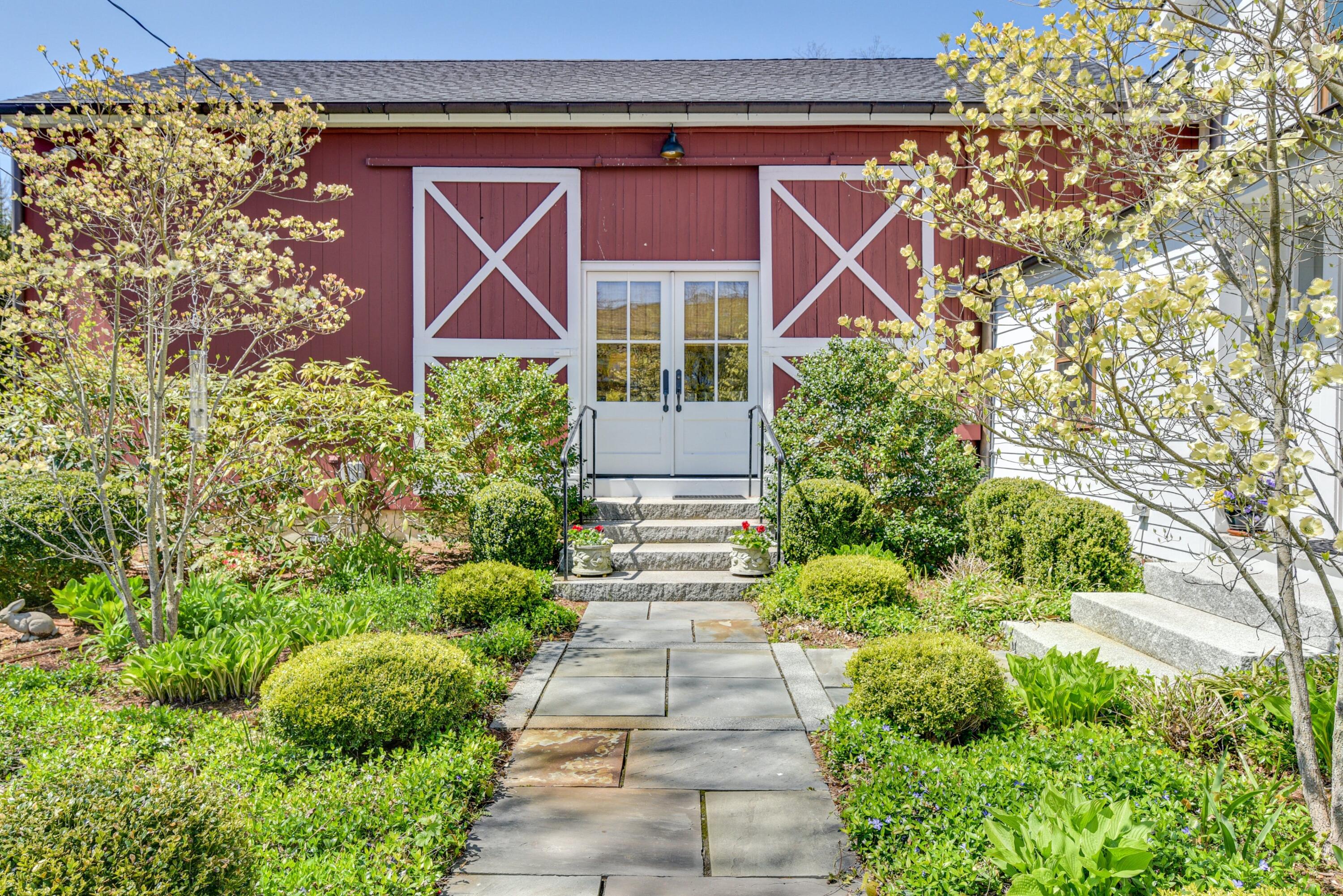 51 White Oak Shade Road New Canaan, CT 06840 - Photo 2 of 40 a front view of a house with garden