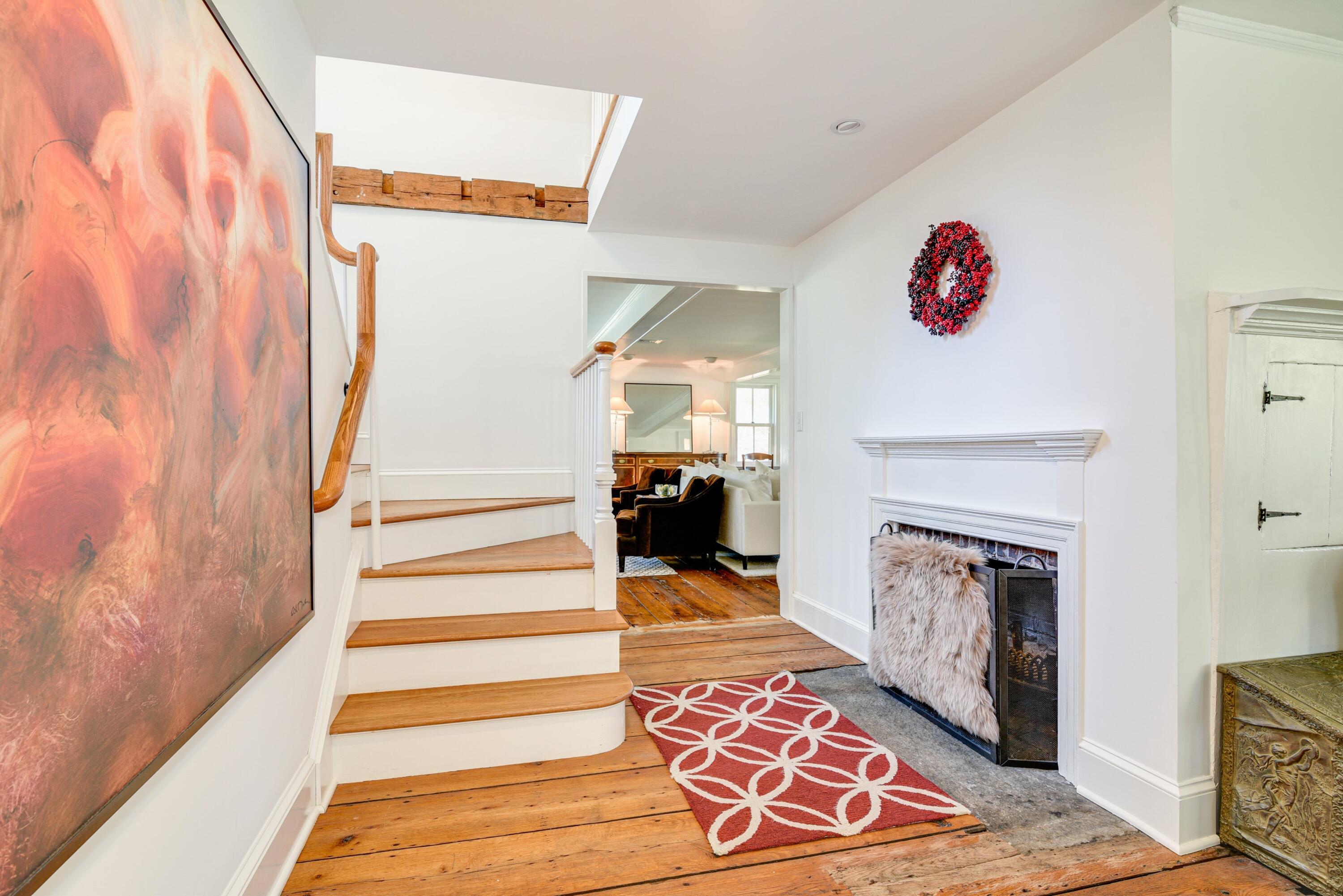 51 White Oak Shade Road New Canaan, CT 06840 - Photo 24 of 40 a view of entryway with furniture and a fireplace