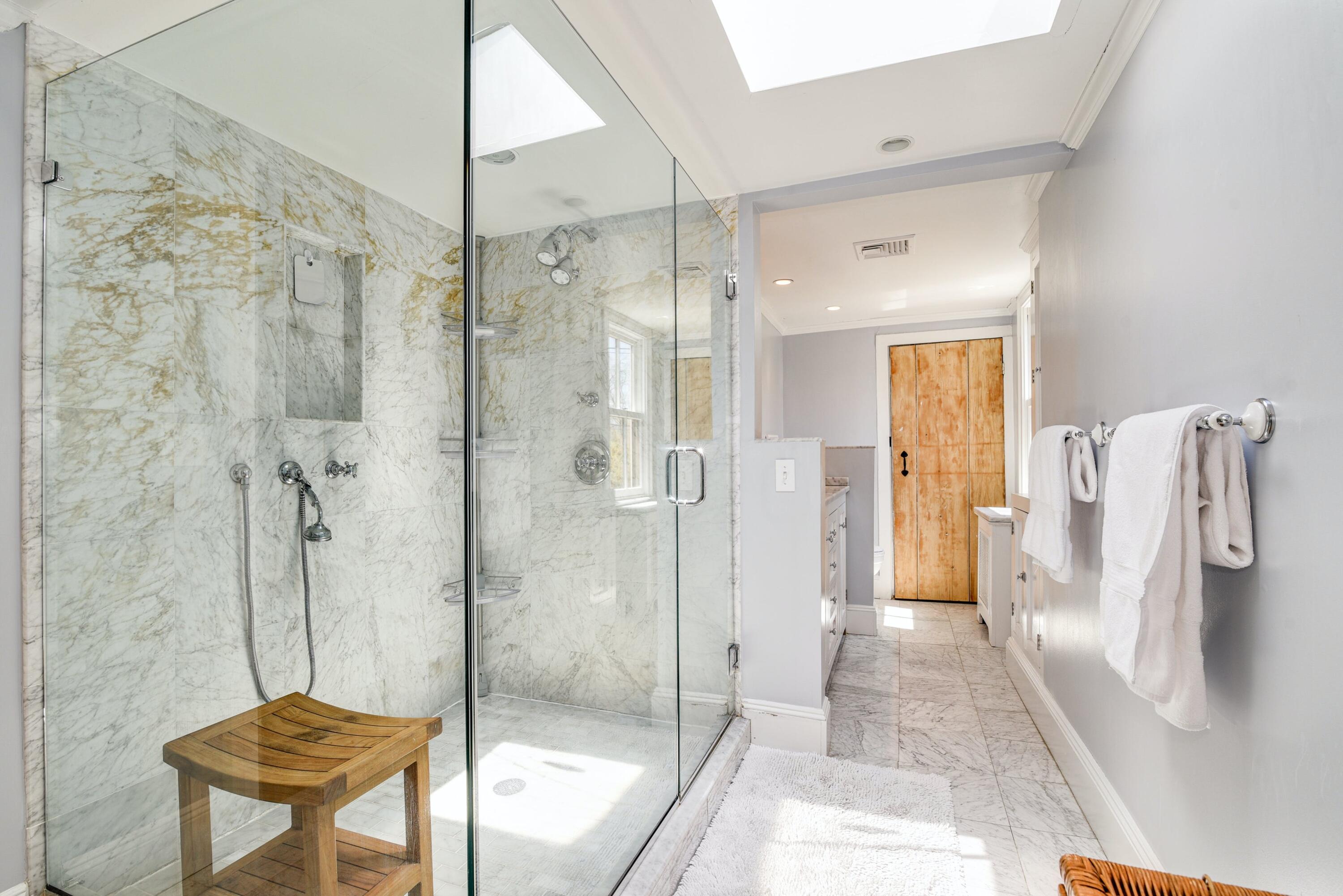 51 White Oak Shade Road New Canaan, CT 06840 - Photo 26 of 40 a bathroom with a shower and a toilet