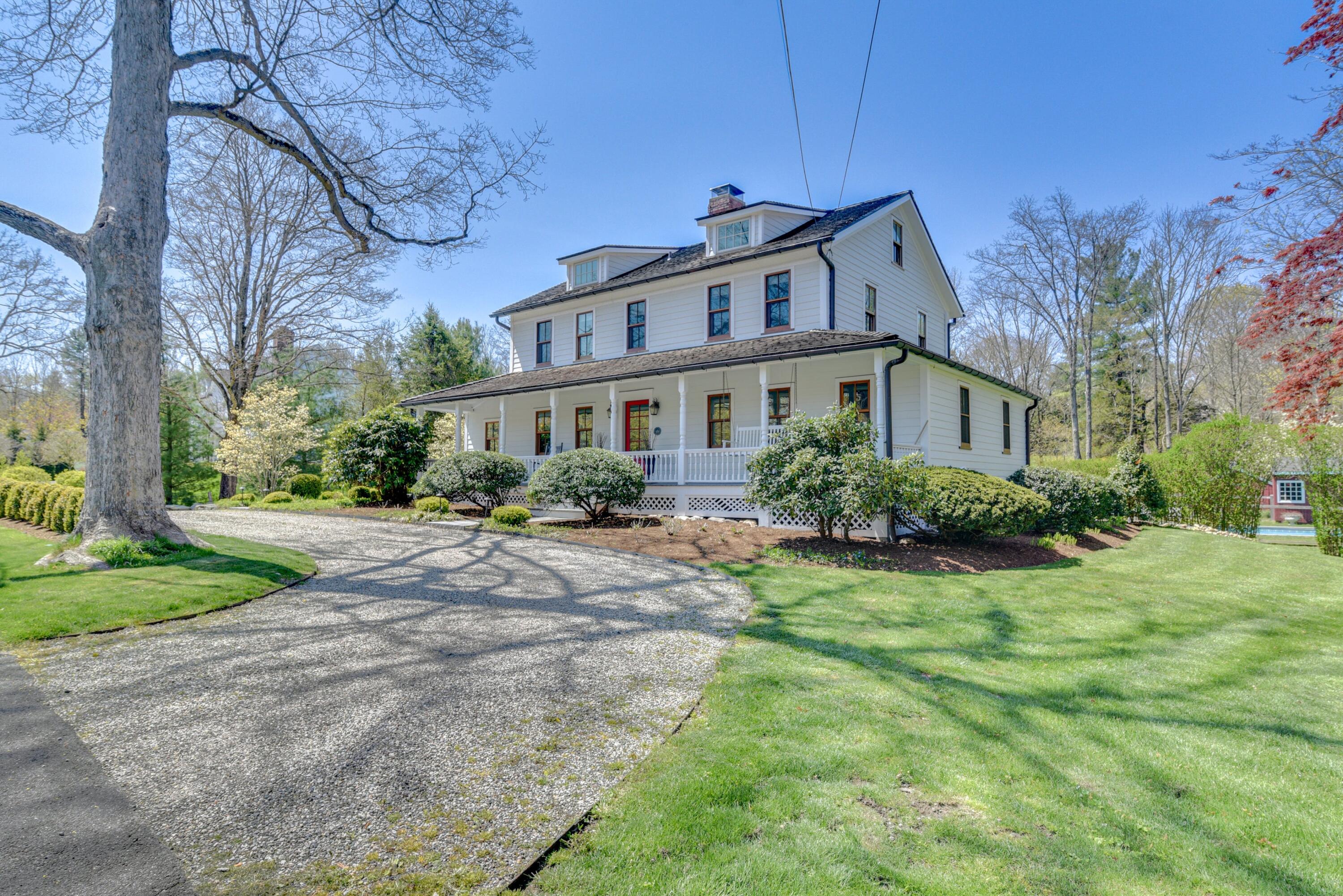 51 White Oak Shade Road New Canaan, CT 06840 - Photo 3 of 40 a house view with a garden space