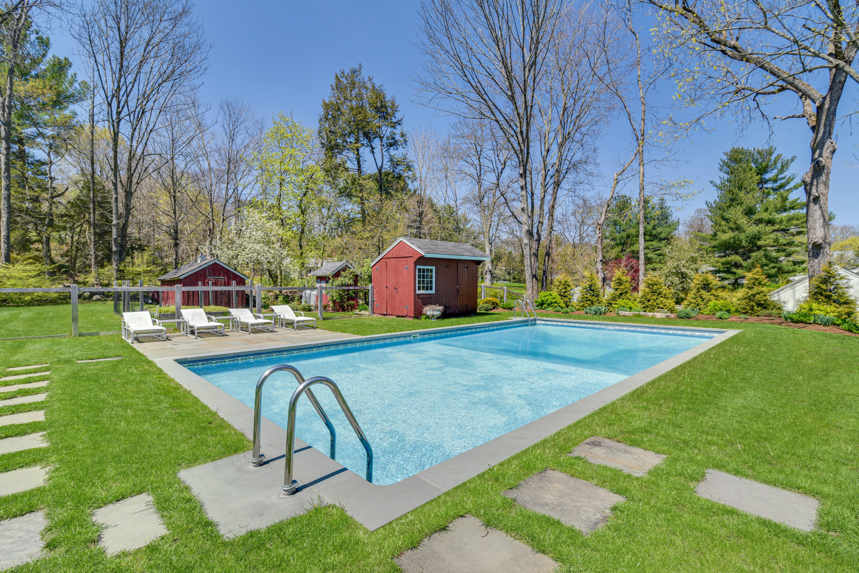 51 White Oak Shade Road New Canaan, CT 06840 - Photo 33 of 40 a view of a backyard with swimming pool