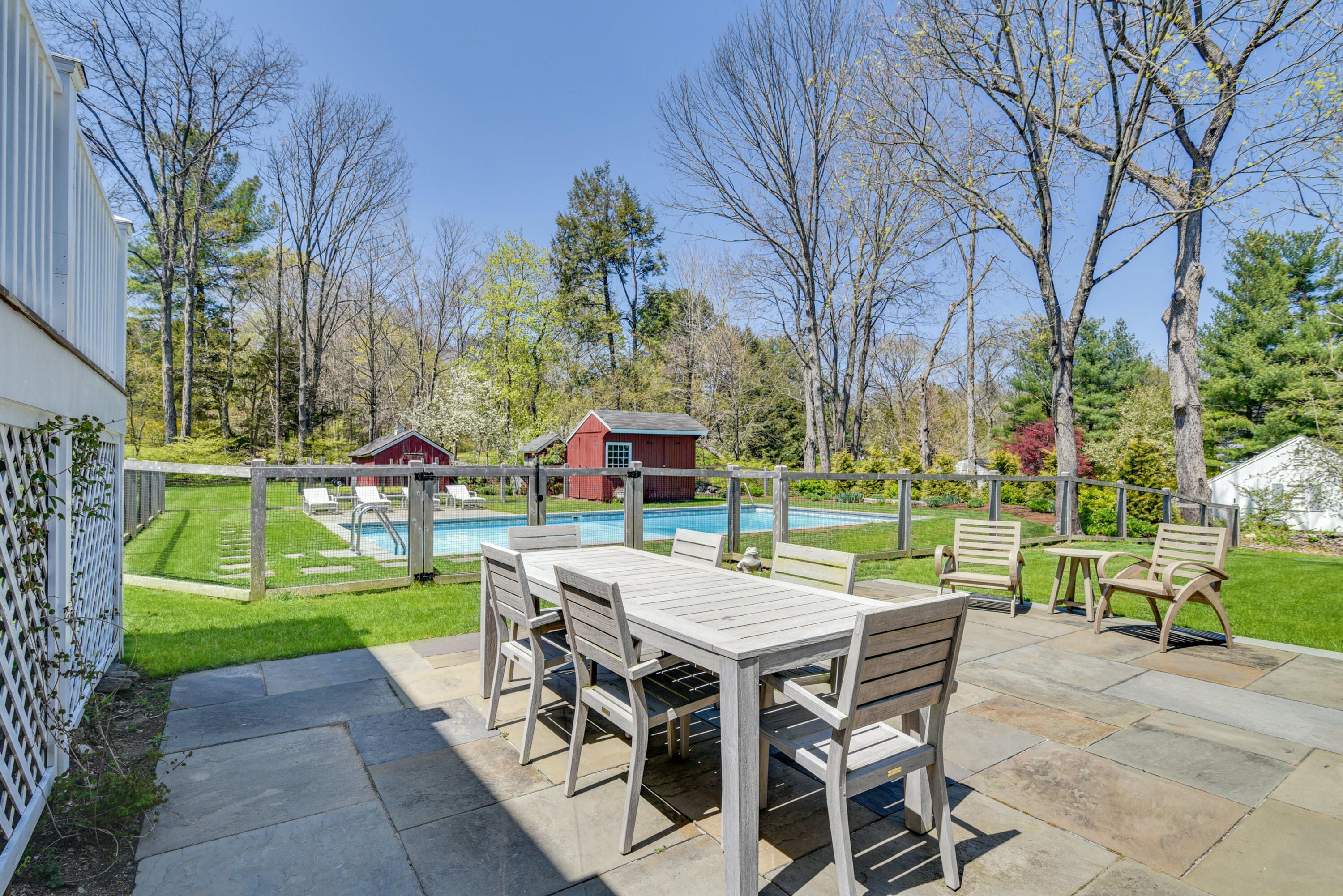 51 White Oak Shade Road New Canaan, CT 06840 - Photo 35 of 40 a view of a dining tables and chairs in a yard