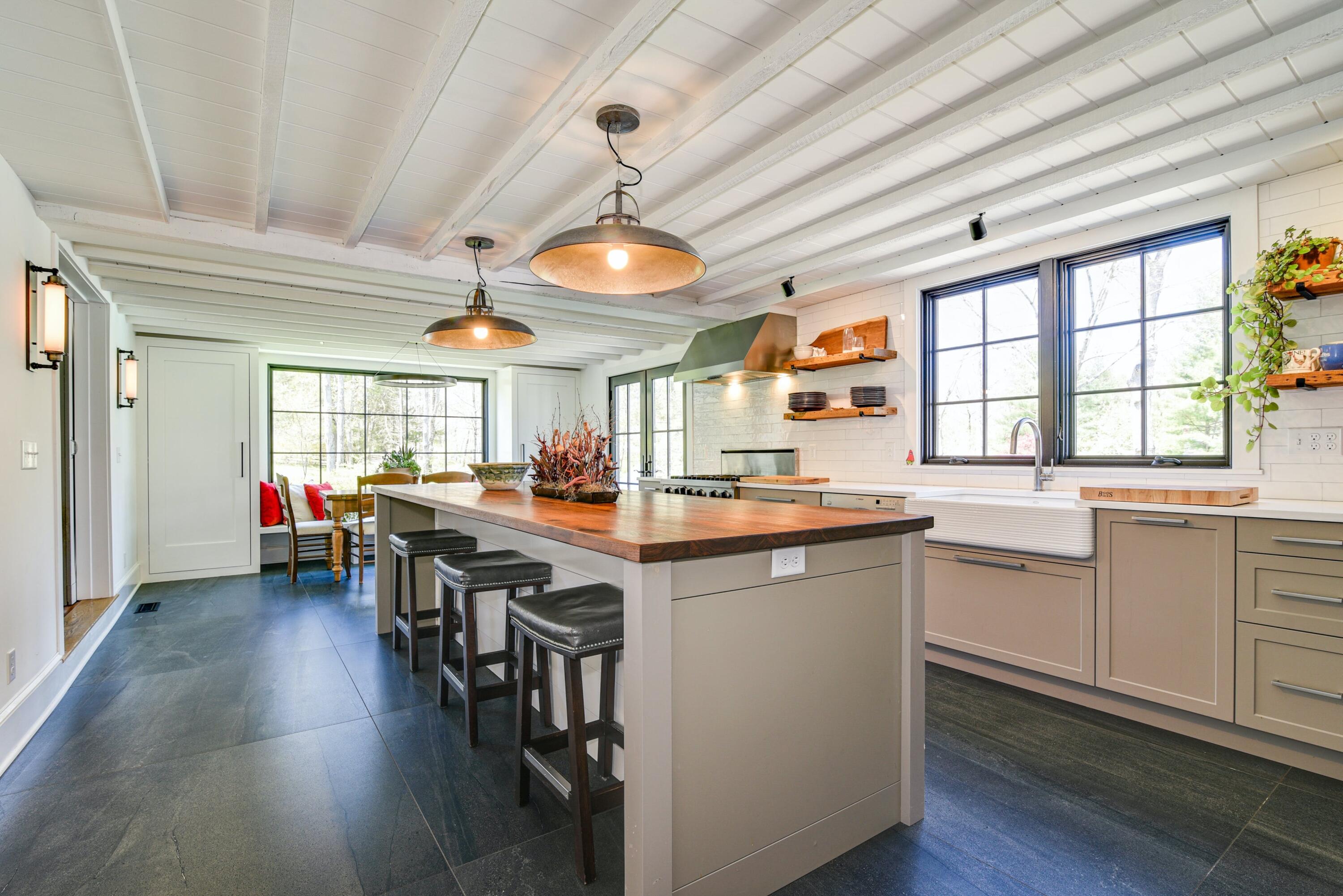 51 White Oak Shade Road New Canaan, CT 06840 - Photo 10 of 40 a kitchen with lots of counter top space and wooden floor