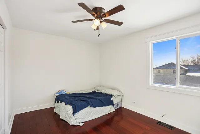 a living room with a bed furniture and a window