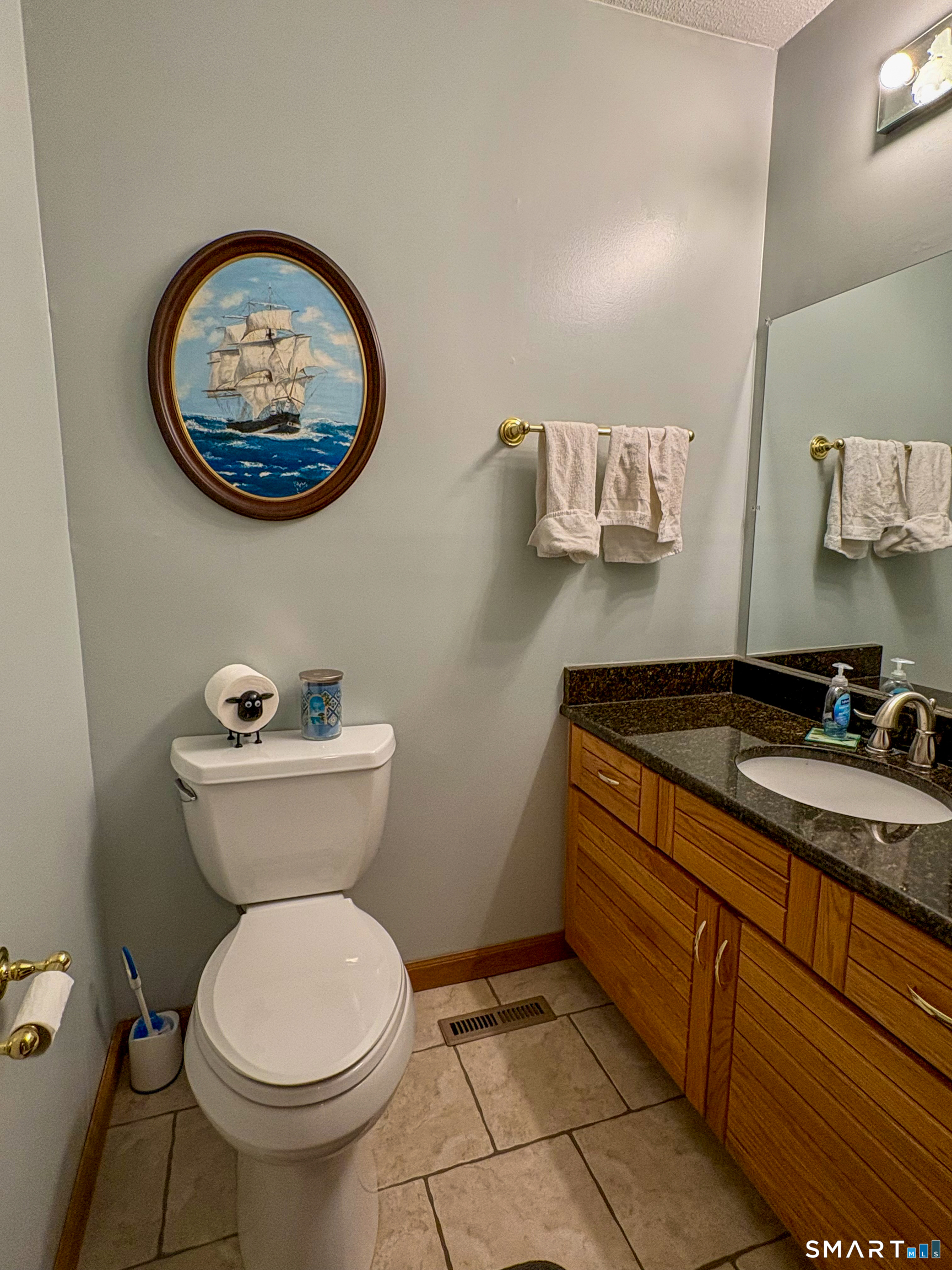 29 Whitney Road Columbia, CT 06237 - Photo 11 of 40 1st floor 1/2 bath located in hallway off of kitchen