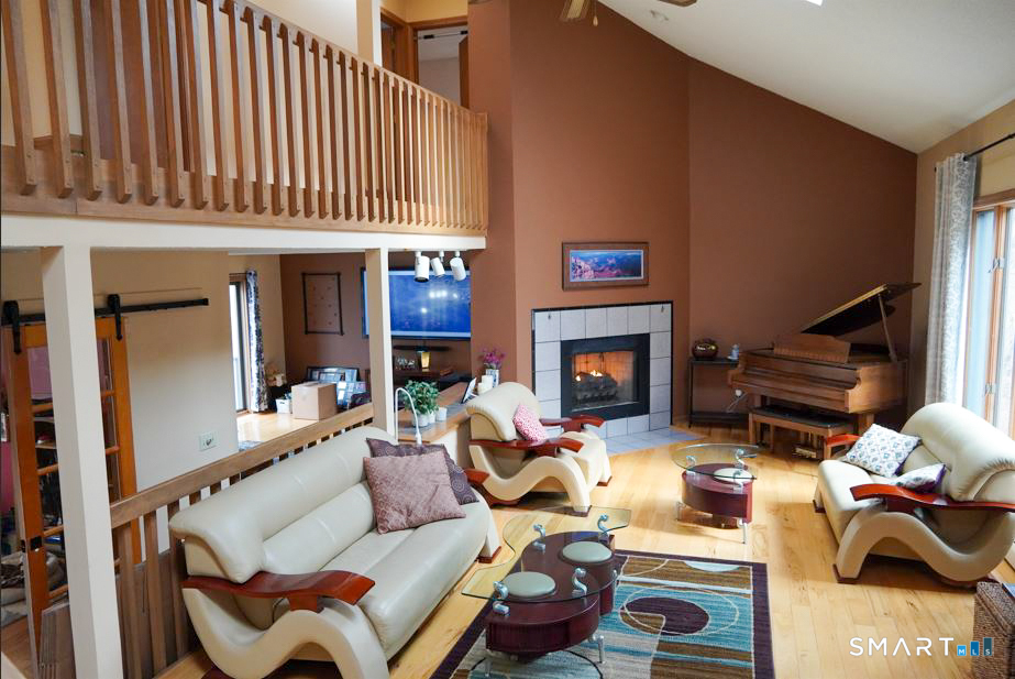 29 Whitney Road Columbia, CT 06237 - Photo 12 of 40 Thru the kitchen you'll find a hallway, the first left room is the office (which faces the deck), to the right is the living room, and the family room is to the left in the back (with wood stove)