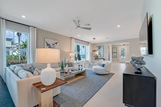 a kitchen with stainless steel appliances granite countertop a refrigerator stove and sink