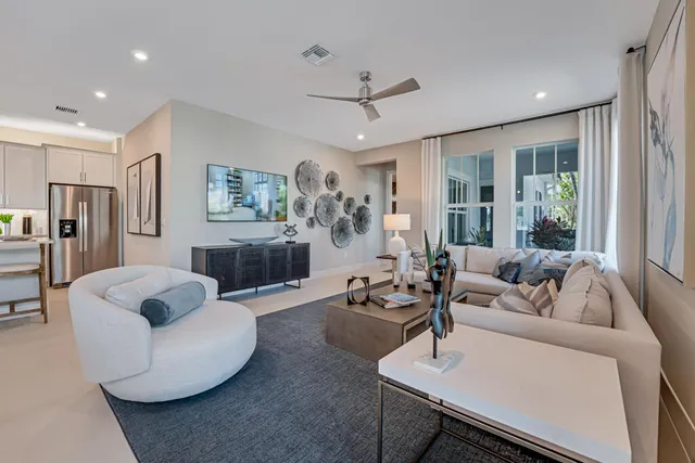 a bedroom with bed and a painting on the wall