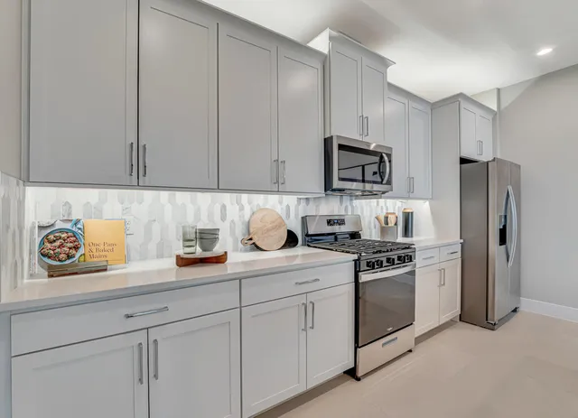 a bedroom with a bed and a chair