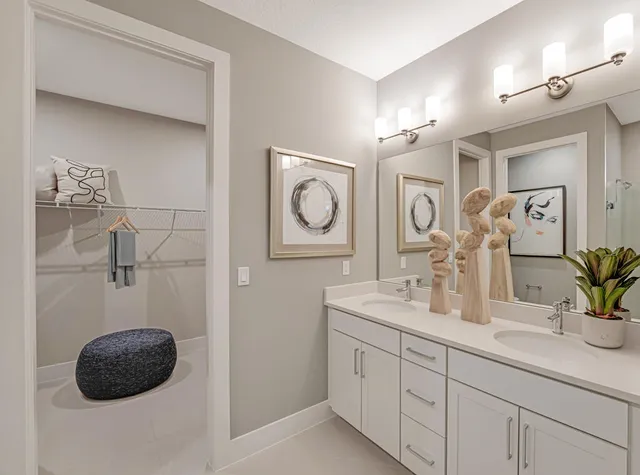 a bedroom with a bed and a lamp