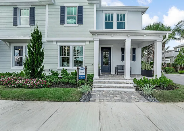 a living room with couch and windows