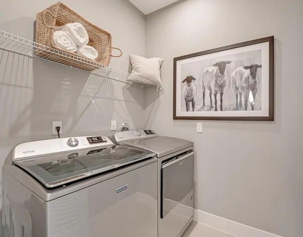 an aerial view of a house with a yard and parking