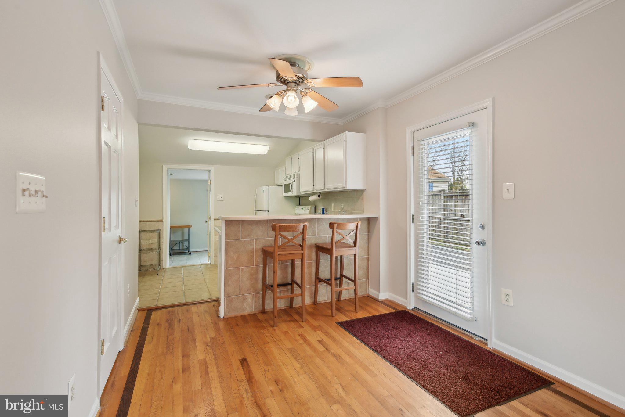 1813 Keymar Road Edgewater, MD 21037 - Photo 11 of 38 a view of a livingroom with furniture wooden floor and a window