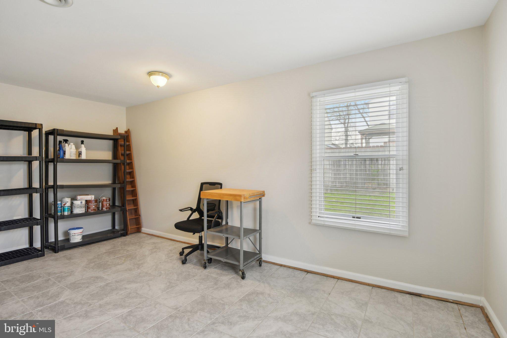 1813 Keymar Road Edgewater, MD 21037 - Photo 24 of 38 a view of a workspace with furniture and a window