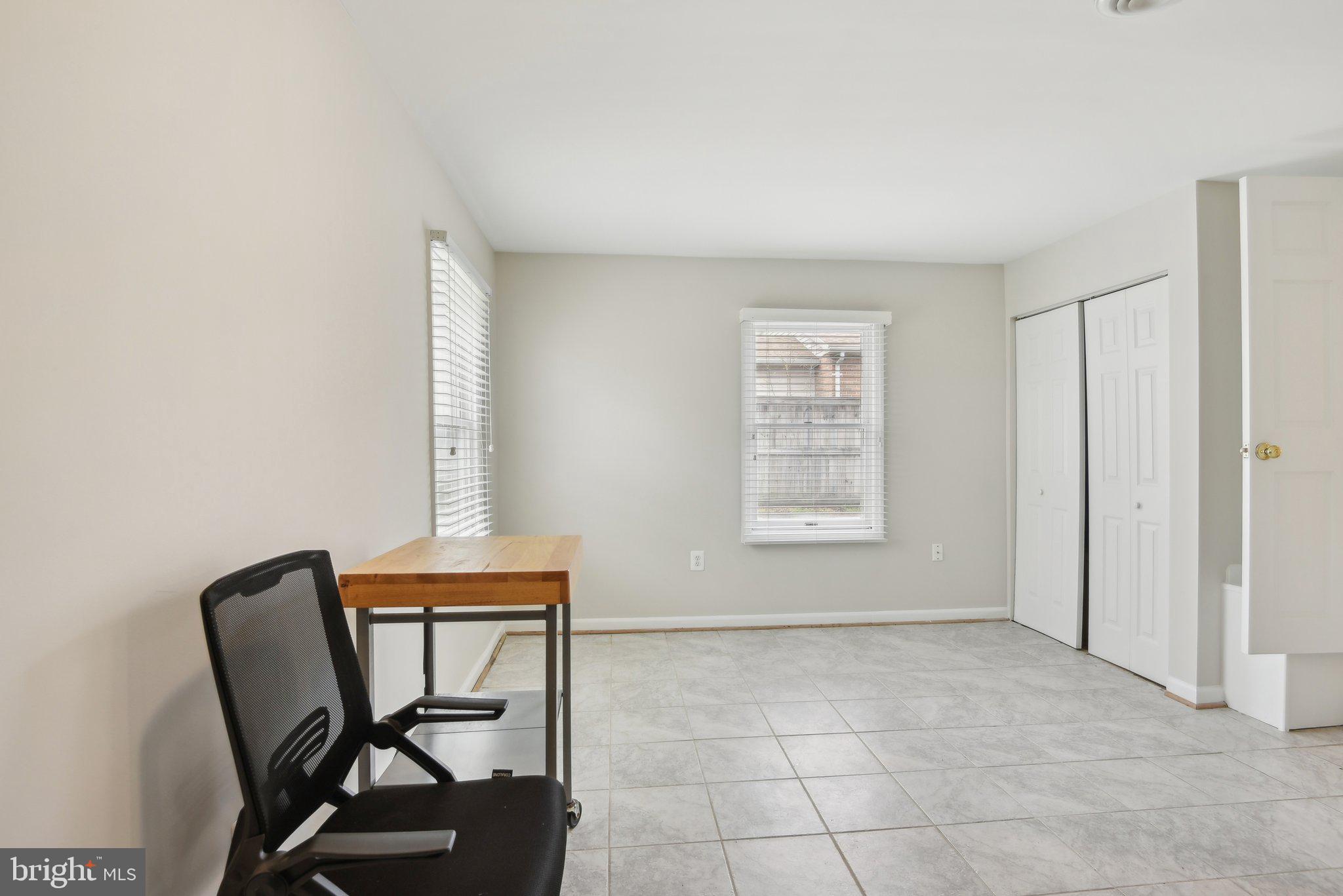 1813 Keymar Road Edgewater, MD 21037 - Photo 25 of 38 a view of room with windows and wooden chair