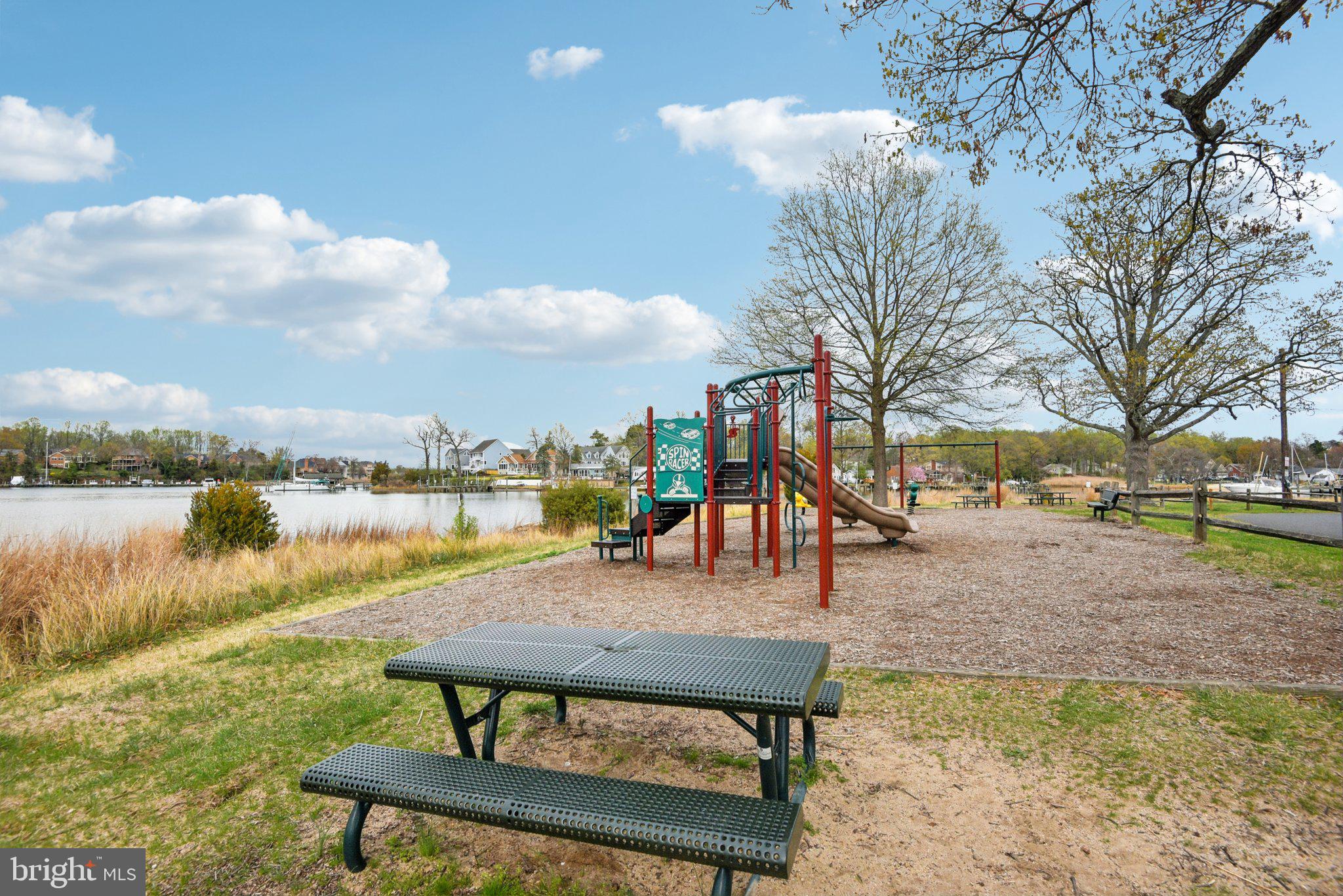 1813 Keymar Road Edgewater, MD 21037 - Photo 36 of 38 a view of a lake with a yard and sitting space