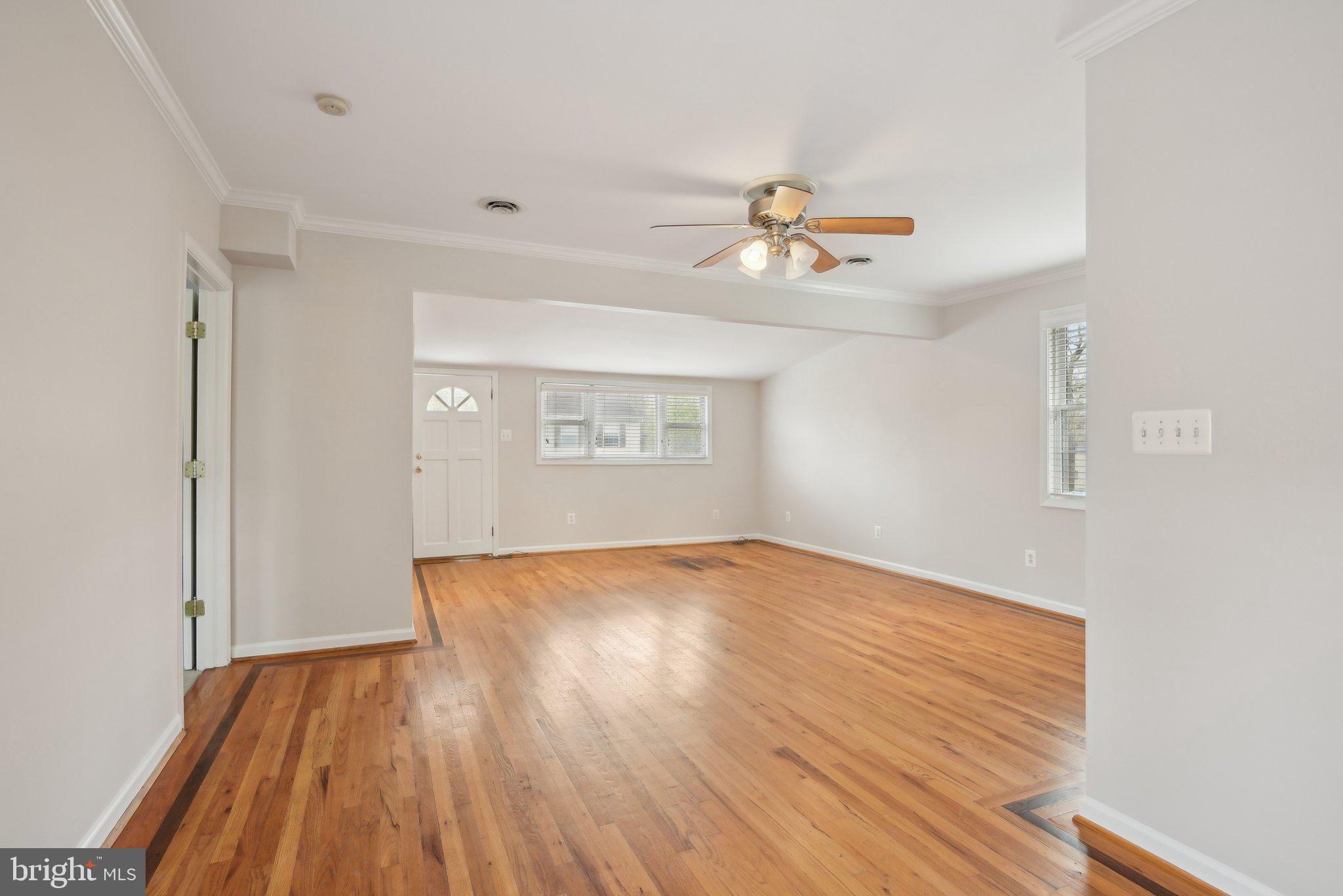 1813 Keymar Road Edgewater, MD 21037 - Photo 8 of 38 wooden floor in an empty room with a window