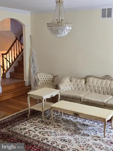 a view of room with hardwood floor and window
