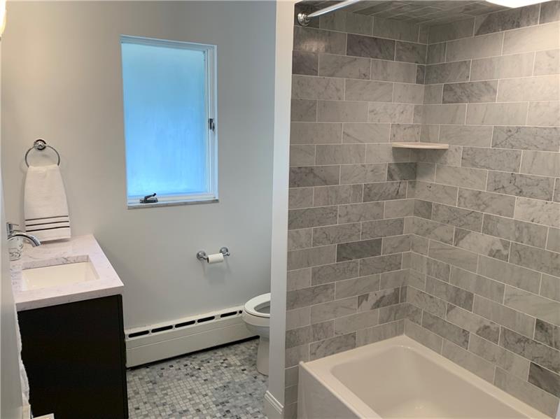 1053 Washington Road Pittsburgh, PA 15228 - Photo 15 of 22 Brand new main floor bathroom, marble walls, floors.