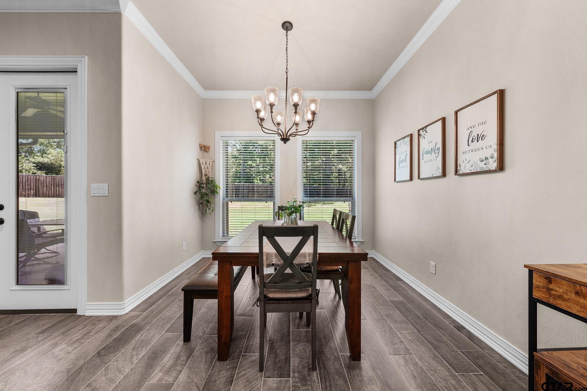 3922 Gable Crest Lane Longview, TX 75605 - Photo 17 of 36 a view of a dining room with furniture window and wooden floor