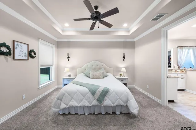 a large white bed in a white room