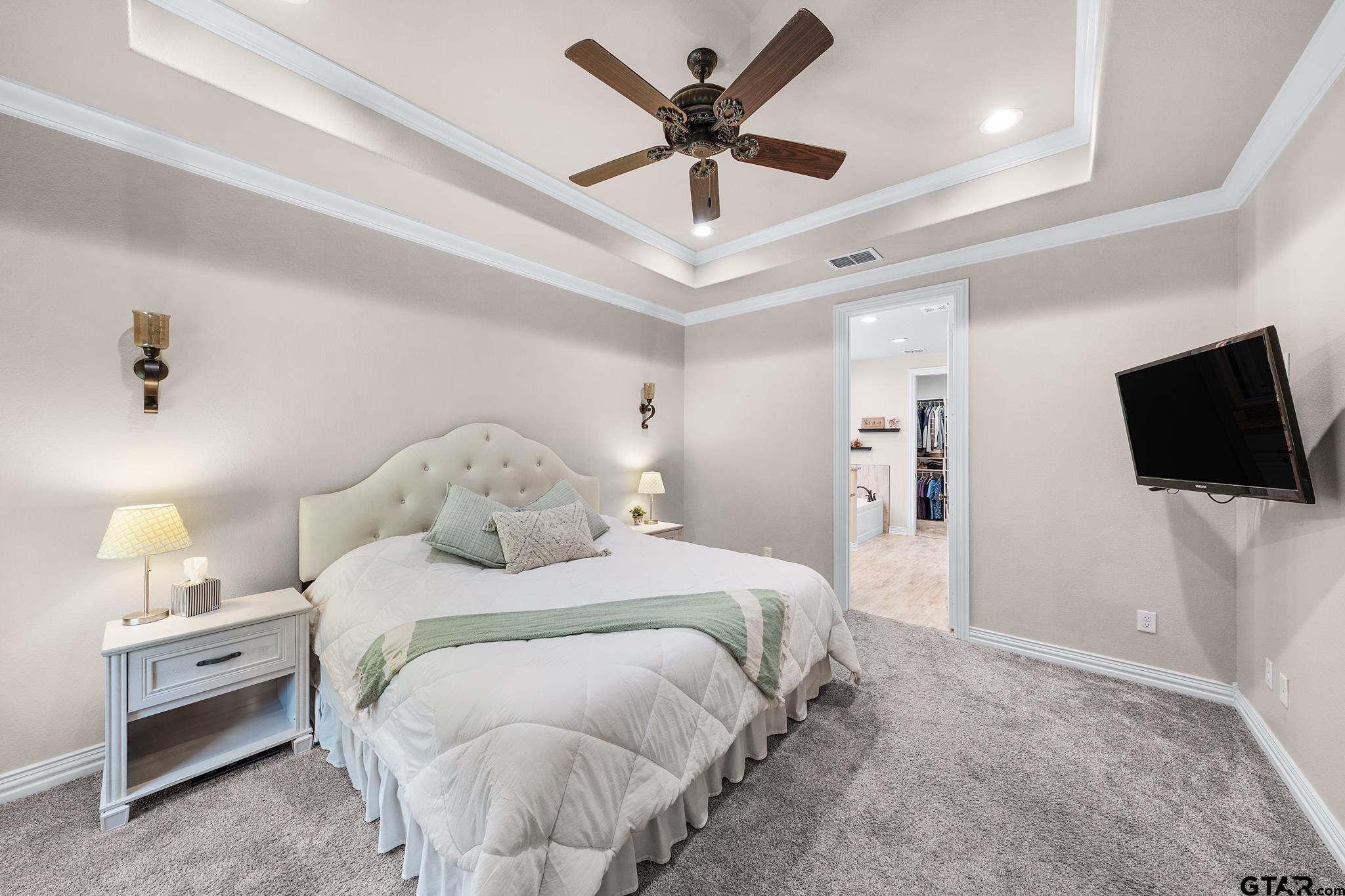 3922 Gable Crest Lane Longview, TX 75605 - Photo 25 of 36 a bedroom with a bed and a flat screen tv