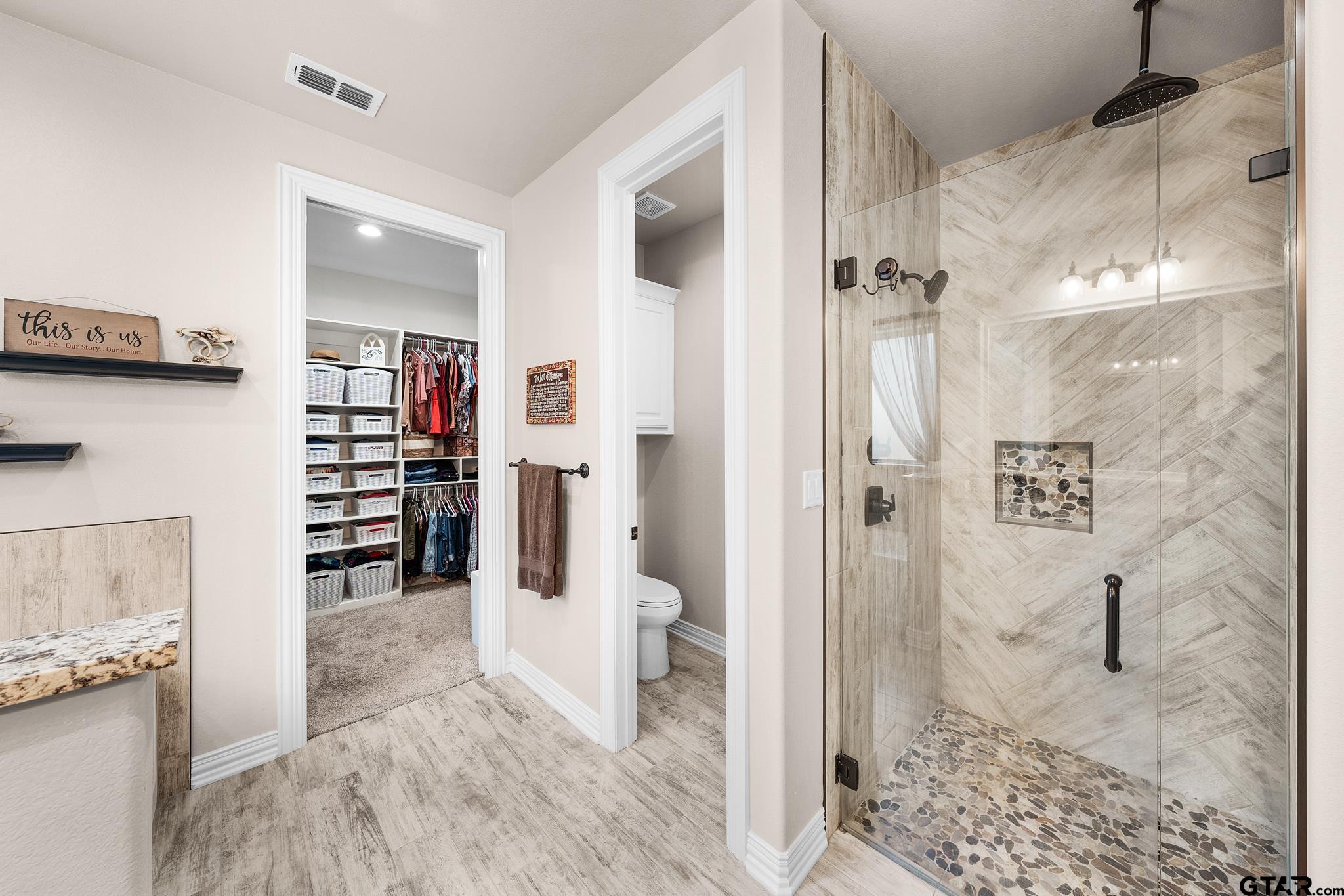 3922 Gable Crest Lane Longview, TX 75605 - Photo 28 of 36 a view of a bathroom with a tub and shower